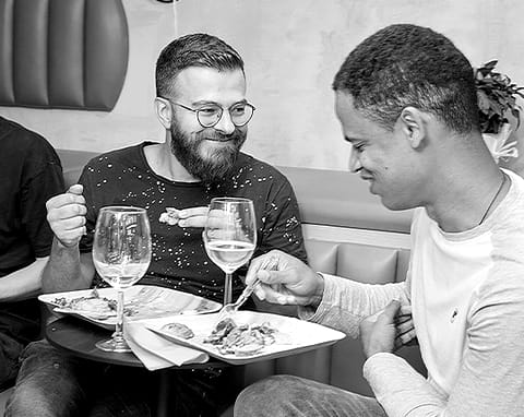 Two colleagues talking over dinner