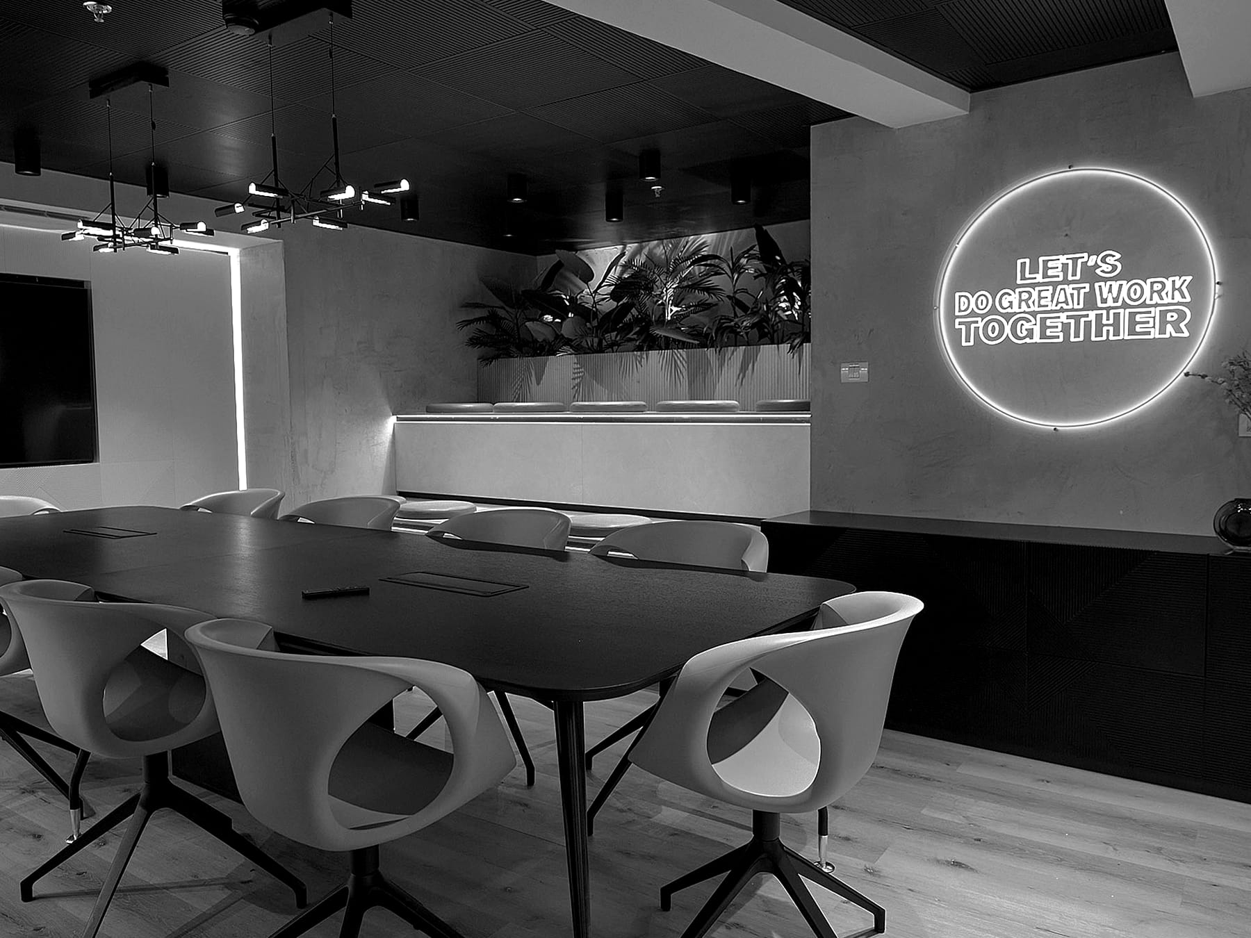 The Netoplay meeting room in Haifa, with a neon ring reading let's do great work together